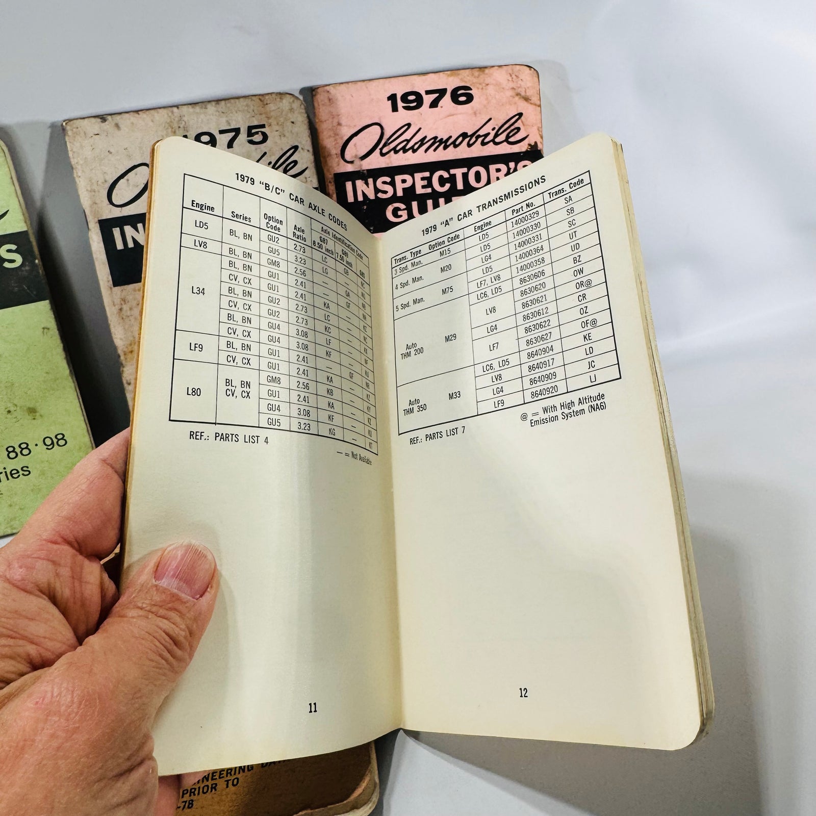 Vintage Oldsmobile Inspector’s Guide Lot (1973–1979) — 8 Pocket Manuals, Codes & Specs (Cutlass / 88 / 98 / F-85 / A-B-C)