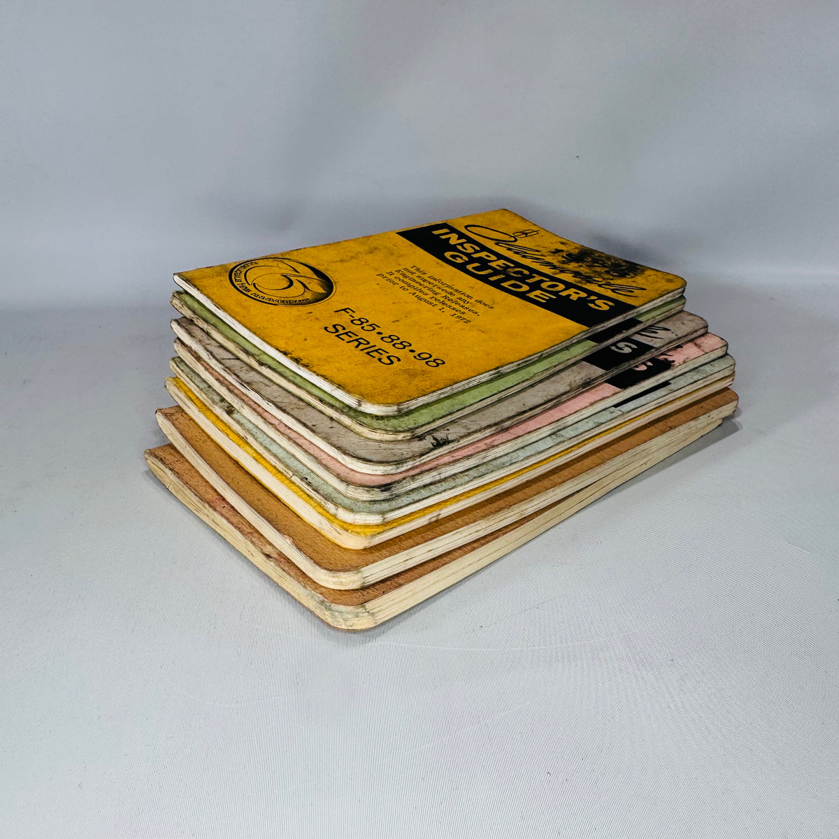 Vintage Oldsmobile Inspector’s Guide Lot (1973–1979) — 8 Pocket Manuals, Codes & Specs (Cutlass / 88 / 98 / F-85 / A-B-C)