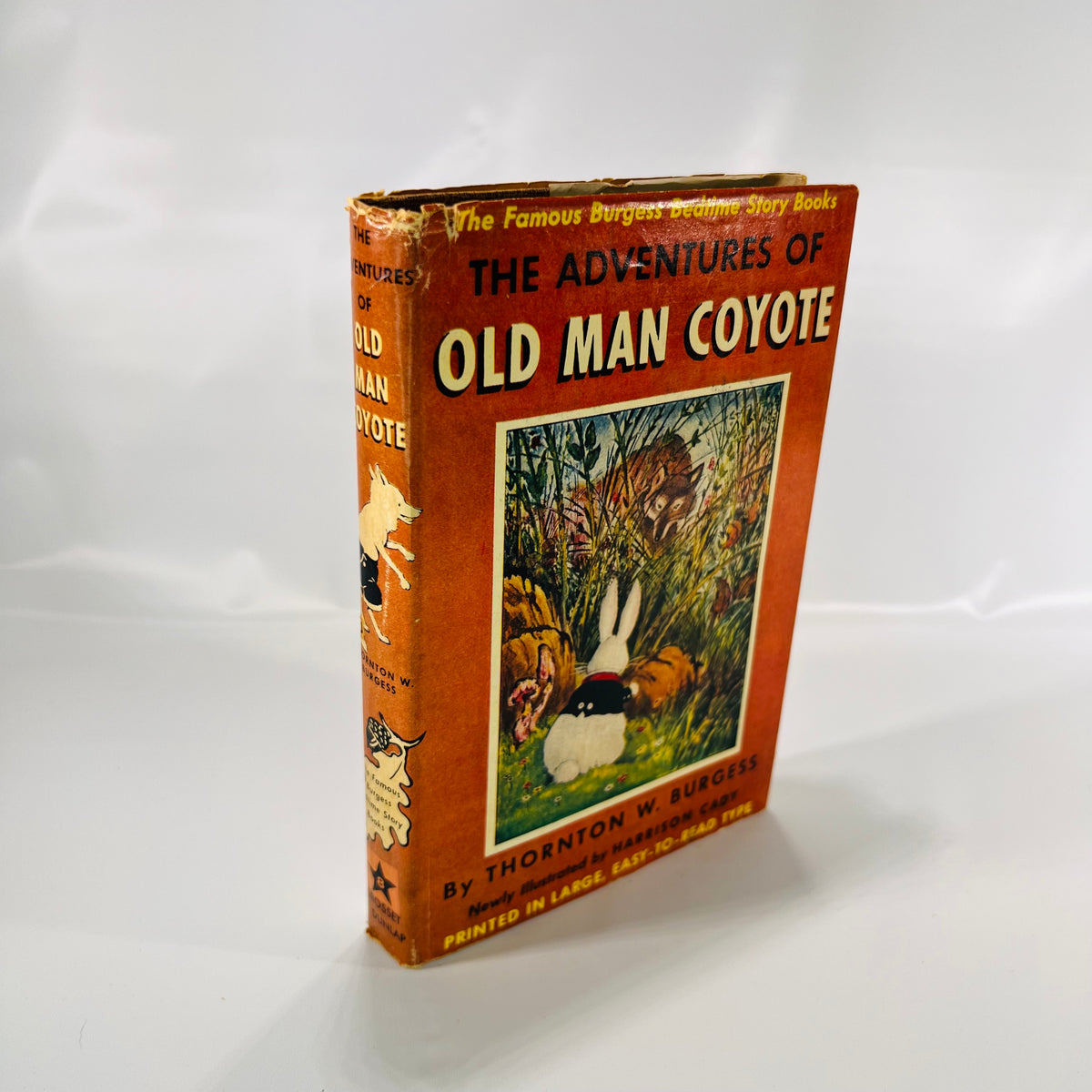 The Adventures of Old Man Coyote 1944, front of the orange pictorial dust jacket