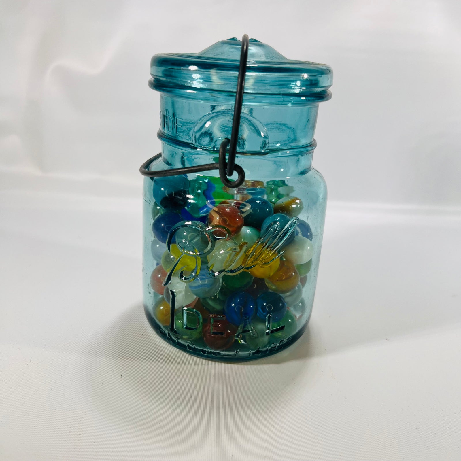 Blue Ideal Pint Mason Jar with Wire Slide Glass Lid filled with Colorful Marbles Vintage Decor