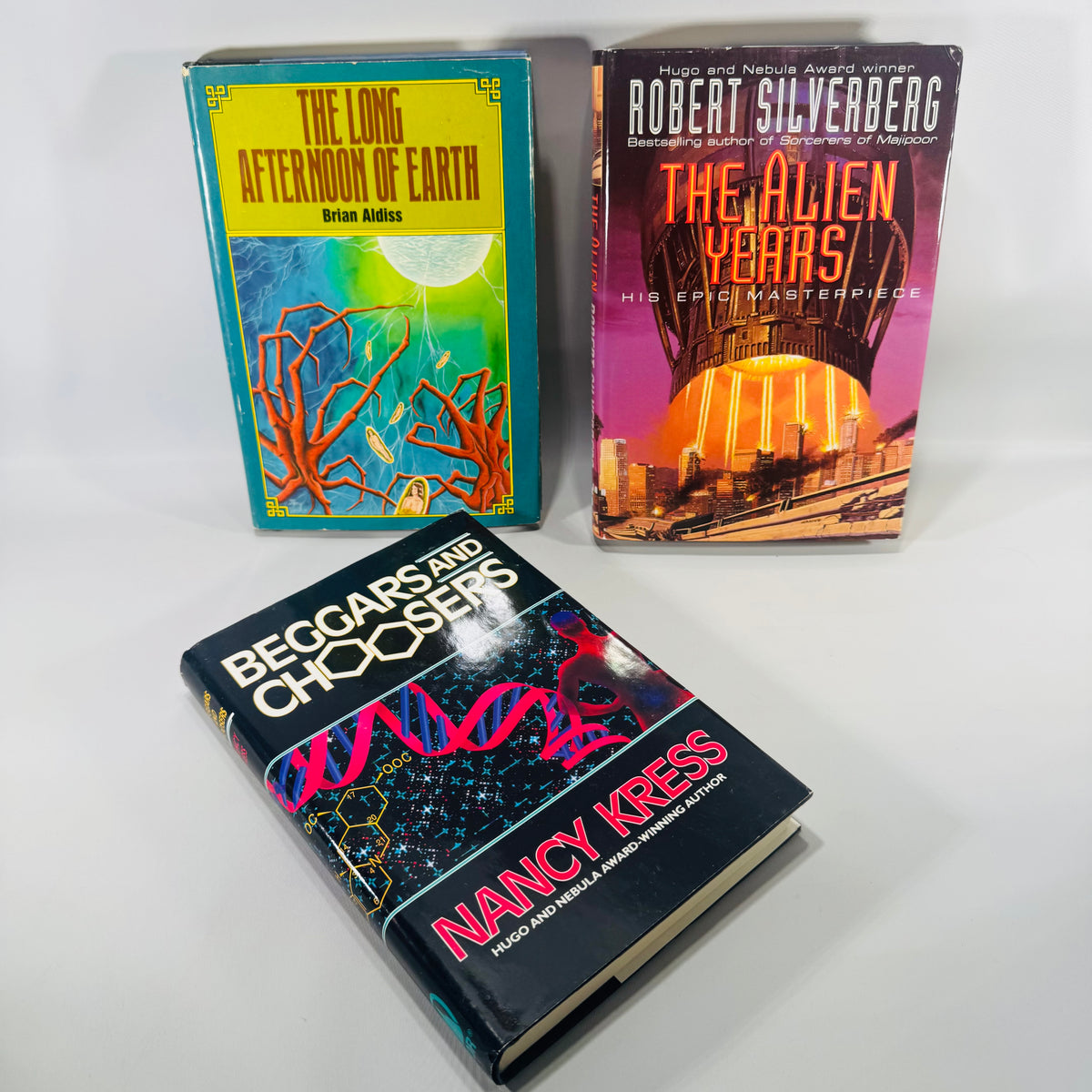 Three books titled 'The Long Afternoon of Earth', 'Beggars and Choosers', and 'The Alien Years'  