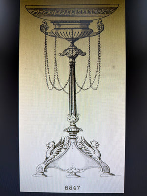 Vintage Elkington & Co catalog illustration of the ‘Grecian’ dessert service tall fruit stand/tazza comport, showing draped hanging chains and a wide pedestal bowl, design no. 6847.