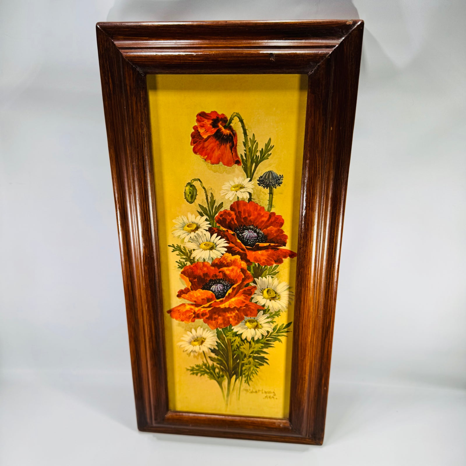 Vintage framed floral wall art with red poppies and white daisies on a golden yellow background in a dark wood frame, vertical 18x9.