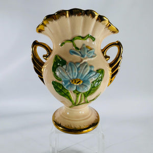 Vintage Hull Art pottery vase with blue raised flowers and gold trim, marked H-6-6½ USA, shown on white background.