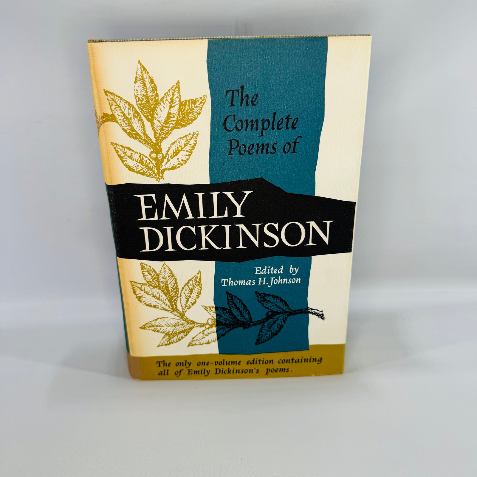 Vintage The Complete Poems of Emily Dickinson hardcover with teal and cream dust jacket, $15.00 flap price, gray cloth boards, tenth printing shown inside.