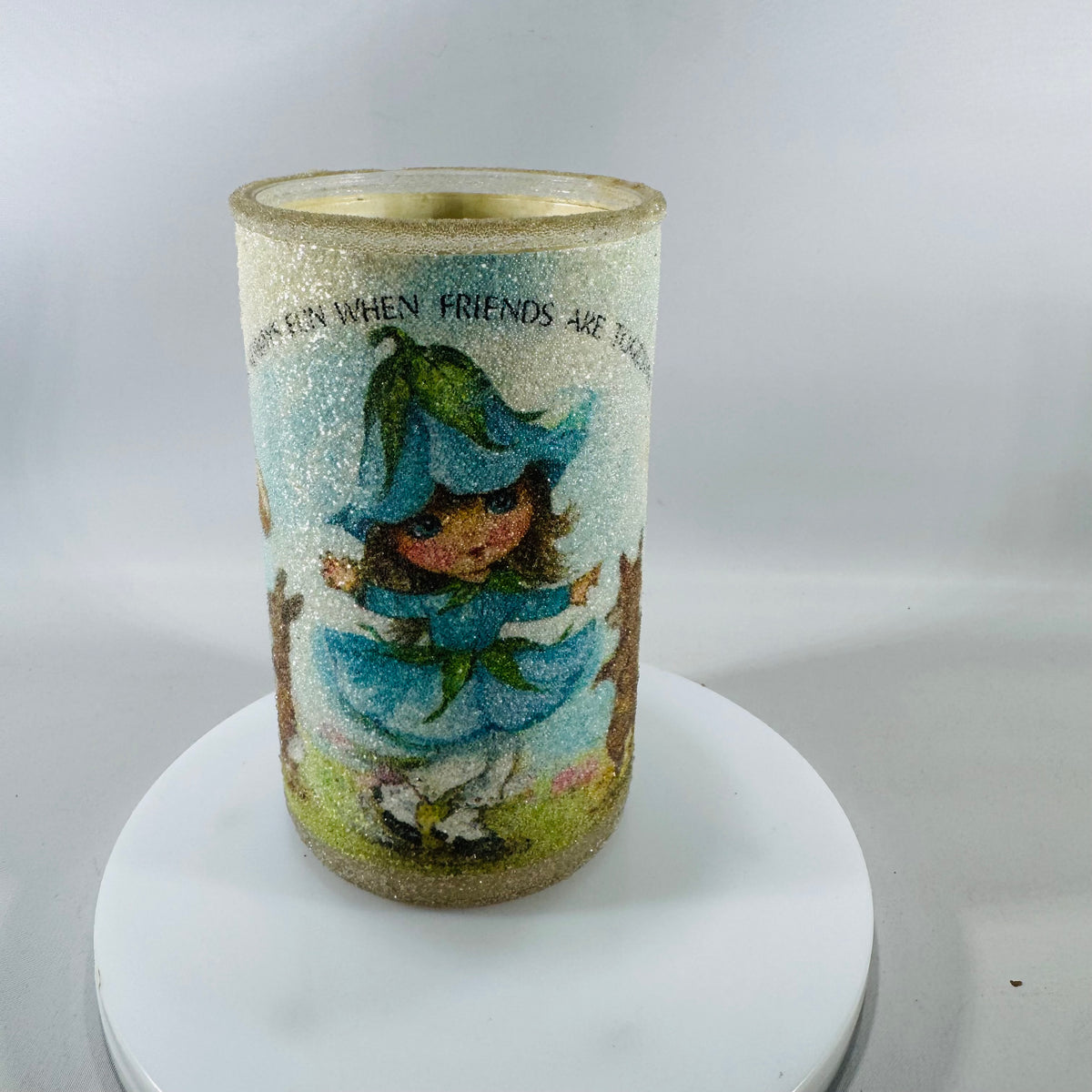 Vintage glitter-textured glass votive candle holder with blue storybook-style figure and friendship wording