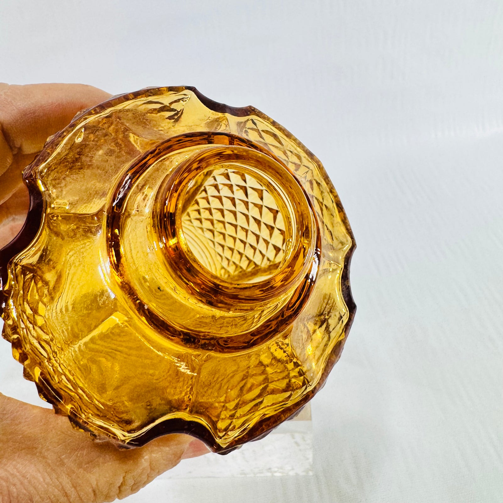 Side view of a small amber diamond point glass light shade
