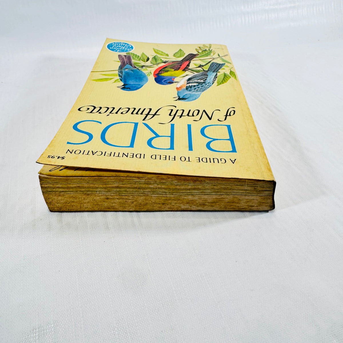 Angled view of the Golden Field Guide showing toned page edges