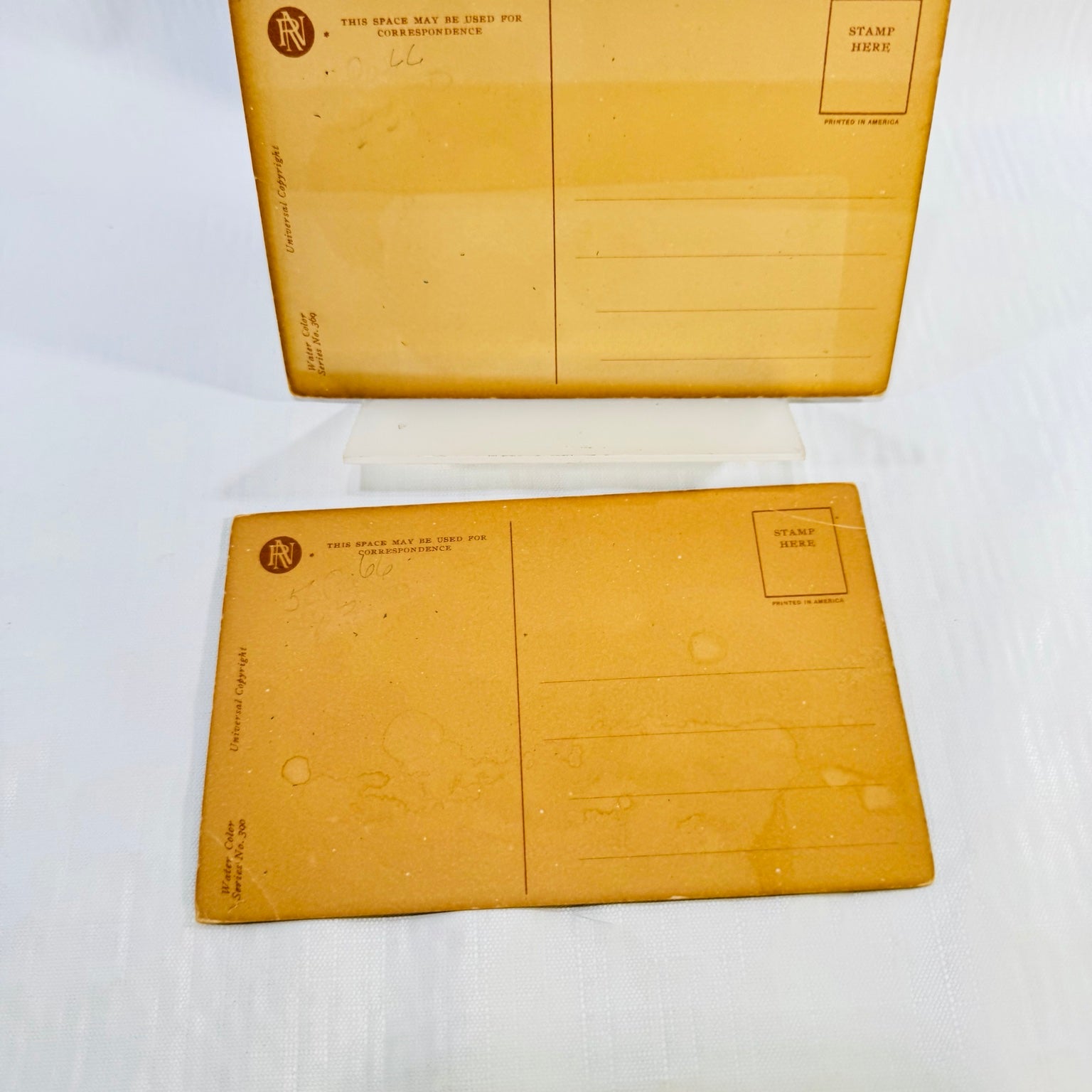 Vanity by Philip Boileau and Well Guarded by Harrison Fisher postcard fronts