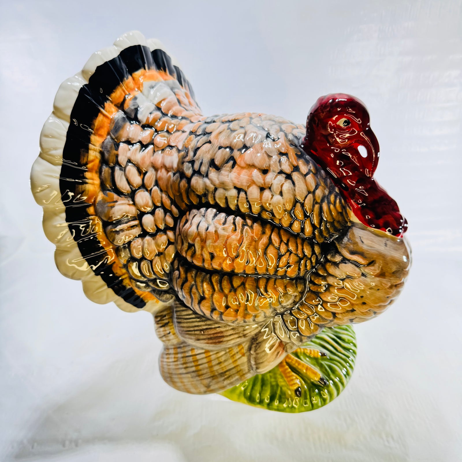 Hand painted ceramic turkey centerpiece, front three quarter view with fanned tail