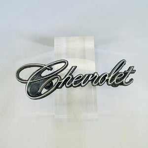 Original Chevrolet 342389 script grille emblem front view