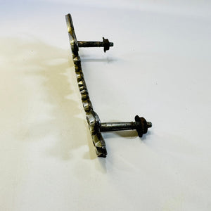 Side view of Chevrolet 342389 grille emblem showing mounting posts