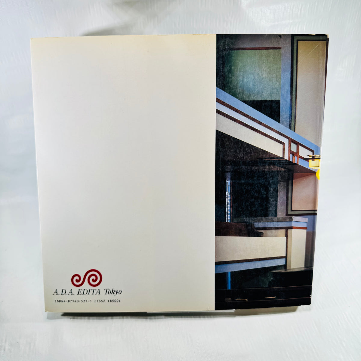 Back cover of Frank Lloyd Wright Monograph 1902-1906 with A.D.A. Edita logo