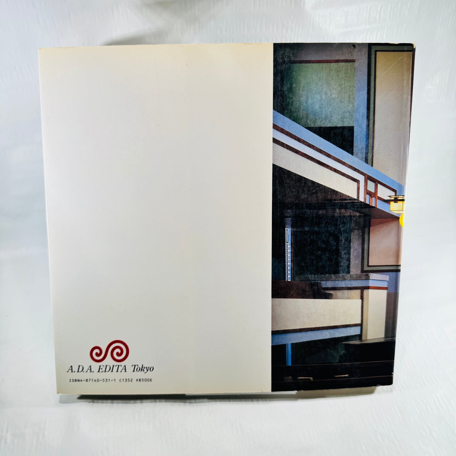 Back cover of Frank Lloyd Wright Monograph 1902-1906 with A.D.A. Edita logo