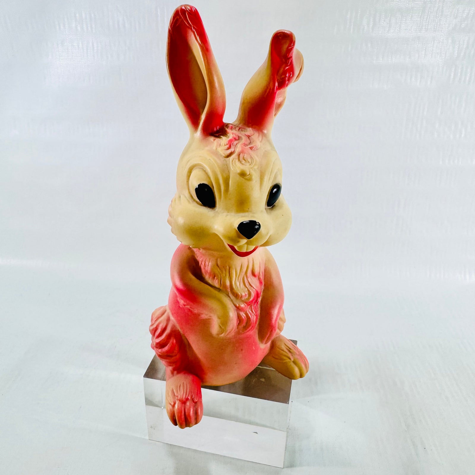 Front view of the cream and pink Holland Hall rabbit squeak toy standing upright.