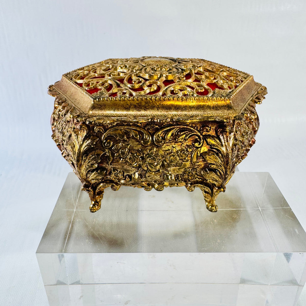 Vintage ornate gold tone metal jewelry casket with red fabric lining, photograph 1 of 9