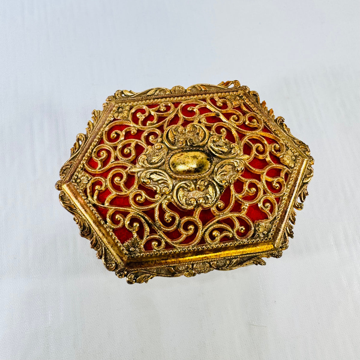Vintage ornate gold tone metal jewelry casket with red fabric lining, photograph 7 of 9