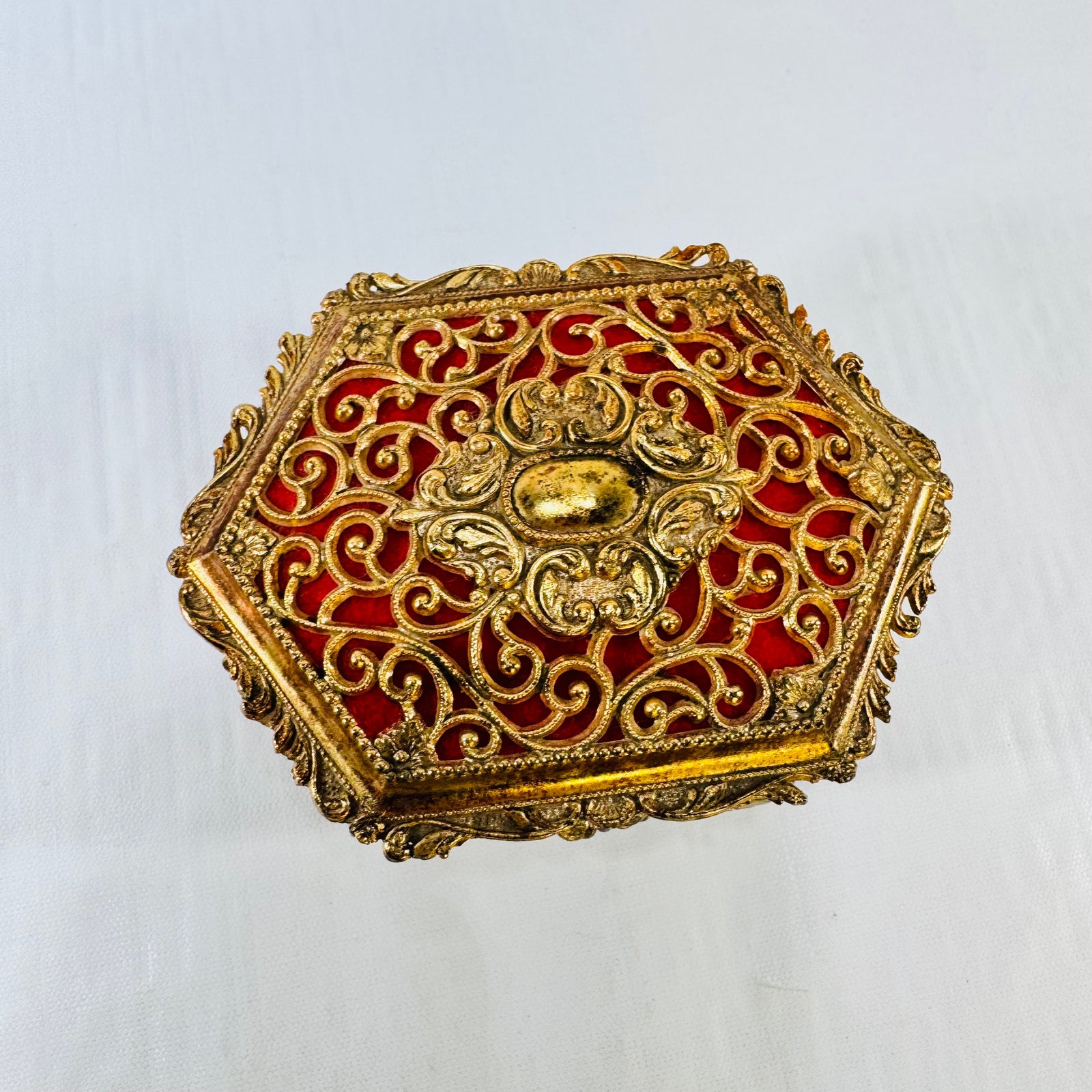 Vintage ornate gold tone metal jewelry casket with red fabric lining, photograph 7 of 9