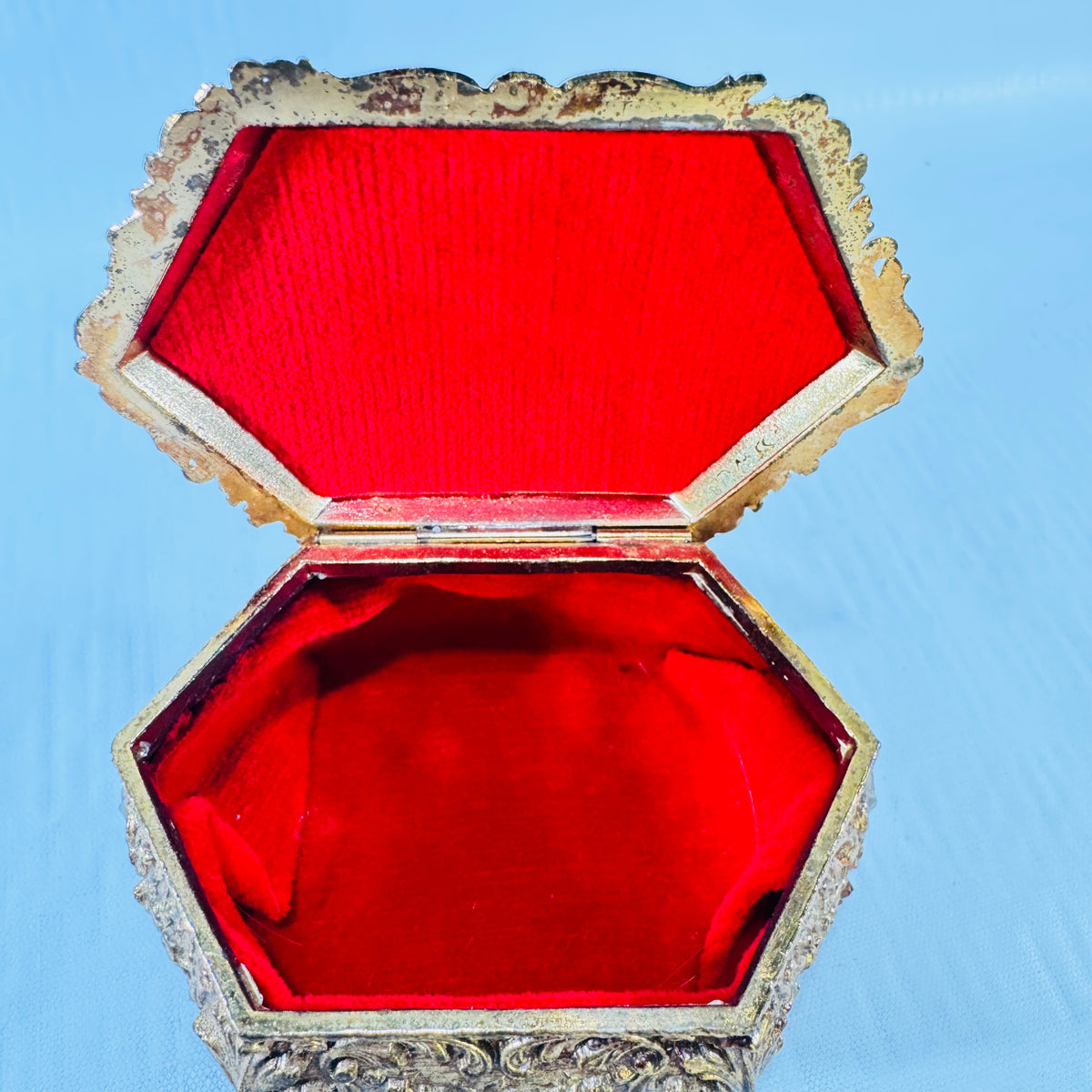 Vintage ornate gold tone metal jewelry casket with red fabric lining, photograph 8 of 9