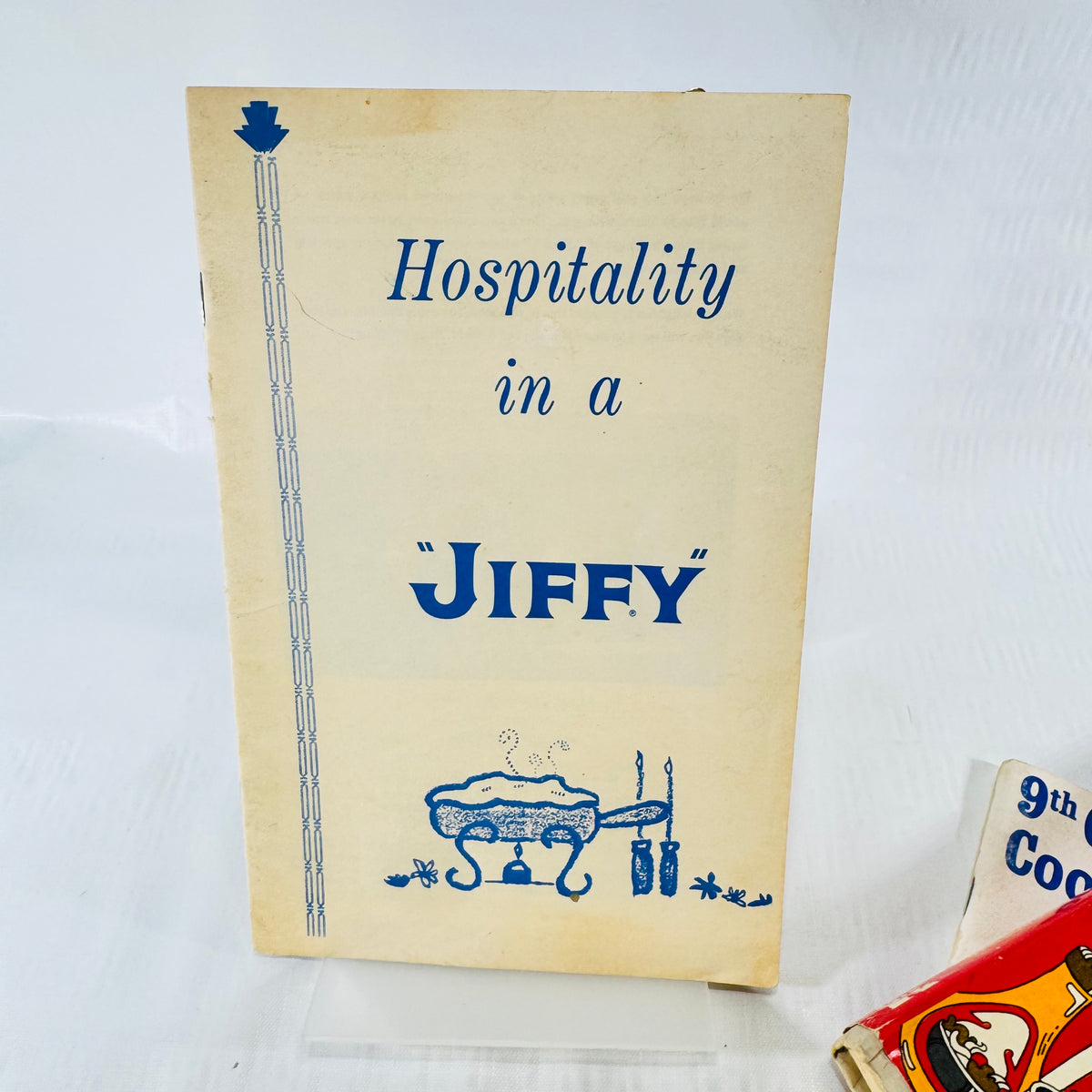 Hospitality in a Jiffy booklet cover with blue lettering and a casserole drawing