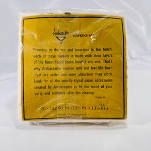 Back of large napkin pack showing Ambassador branding, pricing code ‘65XNK 1H,’ and 20‐count labe