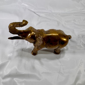 Top-down view of brass elephant figurine showing overall body shape and trunk orientation.