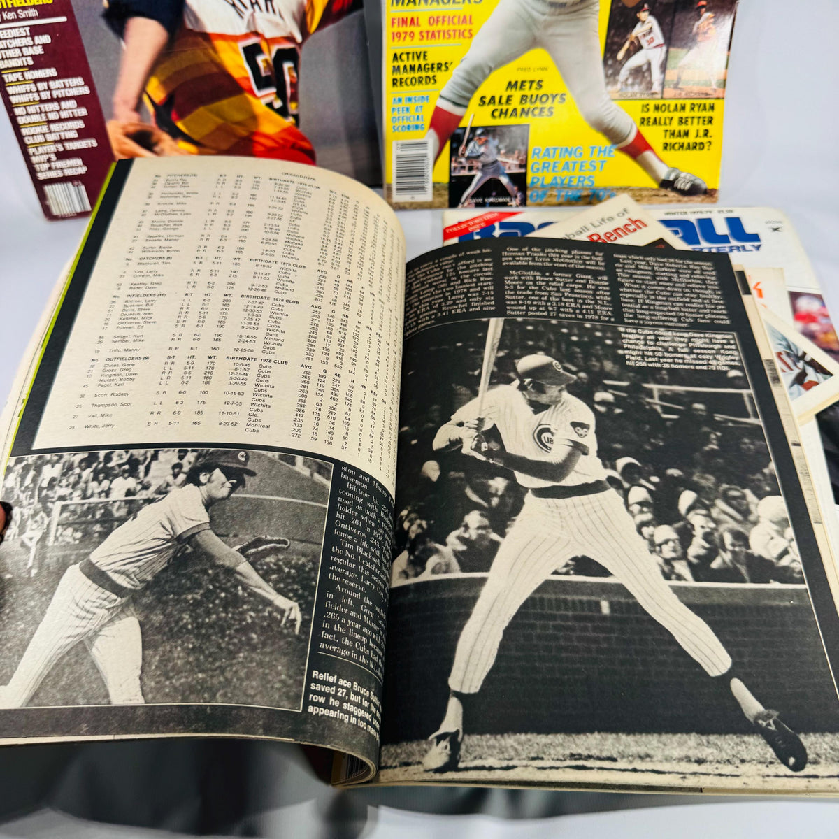 Assorted 1974–1980 baseball magazines and booklets arranged in a fan display, showing colorful covers and vintage MLB players.