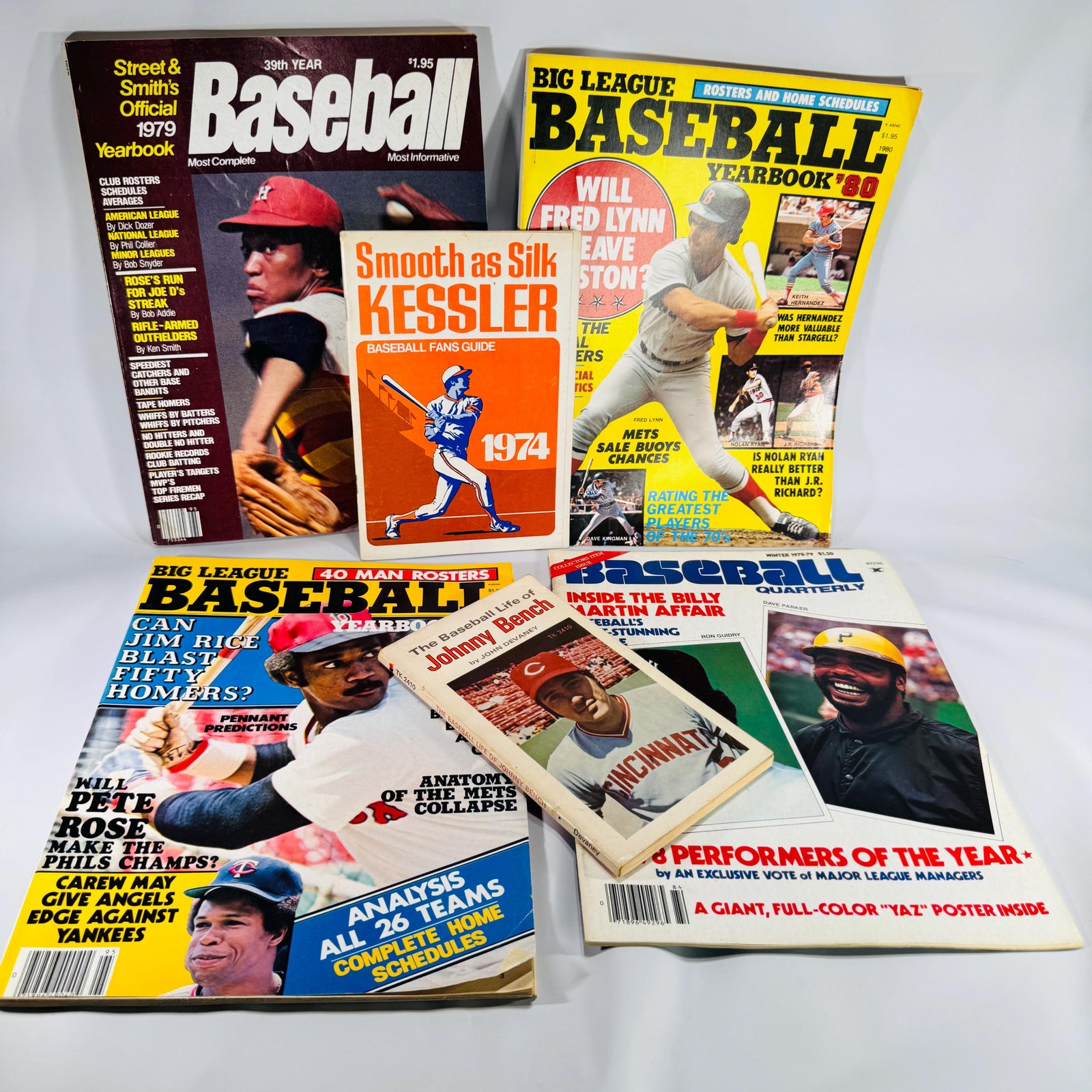 Assorted 1974–1980 baseball magazines and booklets arranged in a fan display, showing colorful covers and vintage MLB players.