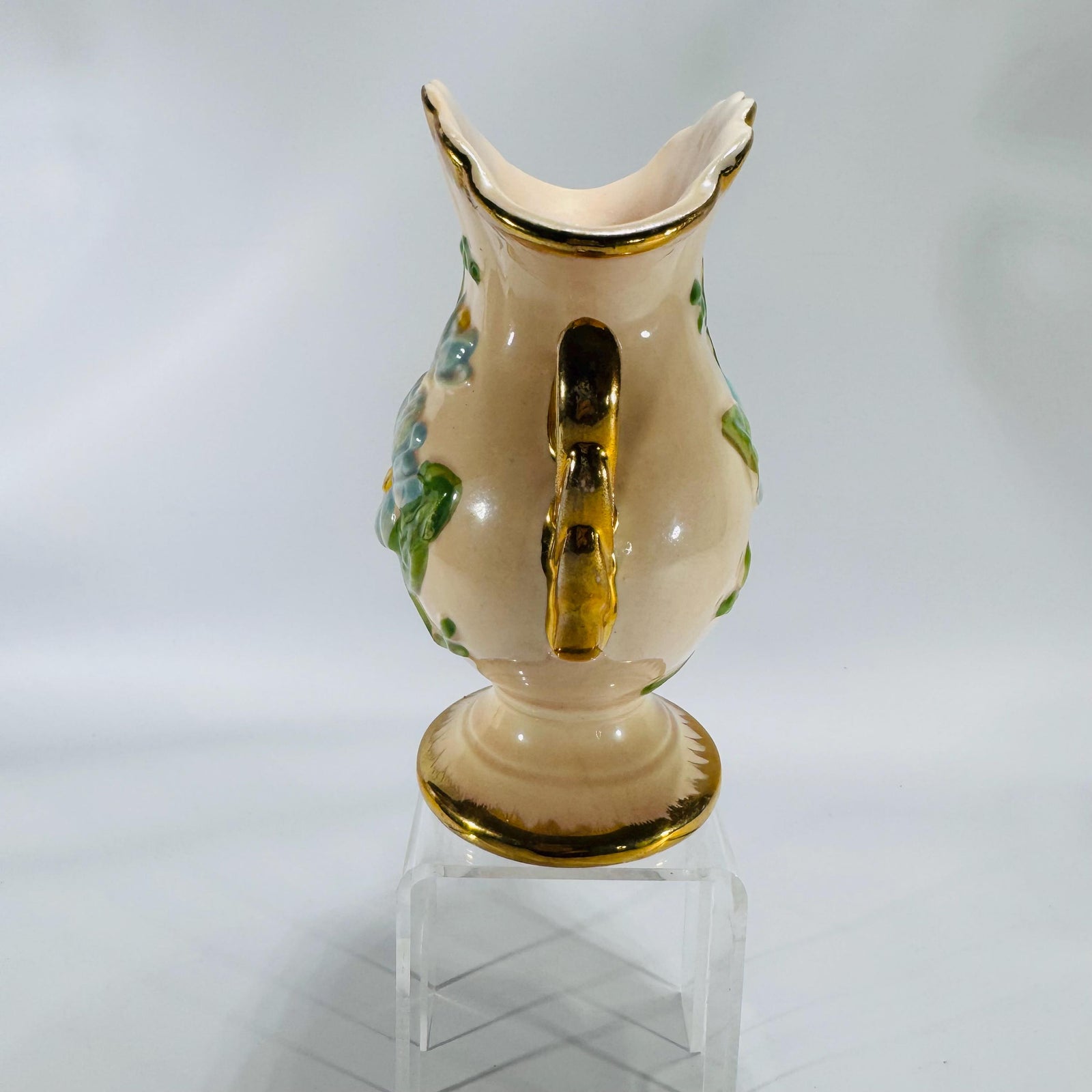 Vintage Hull Art pottery vase with blue raised flowers and gold trim, marked H-6-6½ USA, shown on white background.