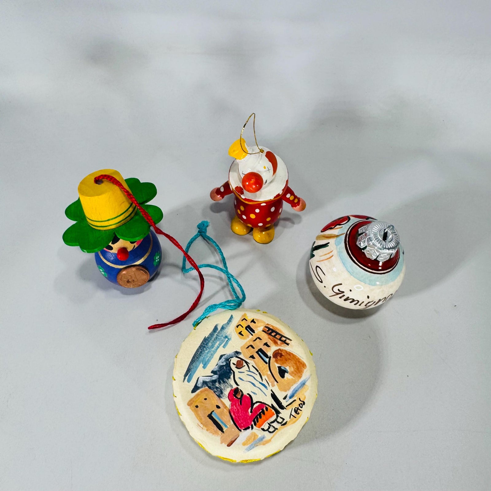 Lot of 4 Vintage World Travel Christmas Ornaments | Wood Clown, German Pfennig Doll, Taos Drum, Hand-Painted Poppy Ball | Estate Collection