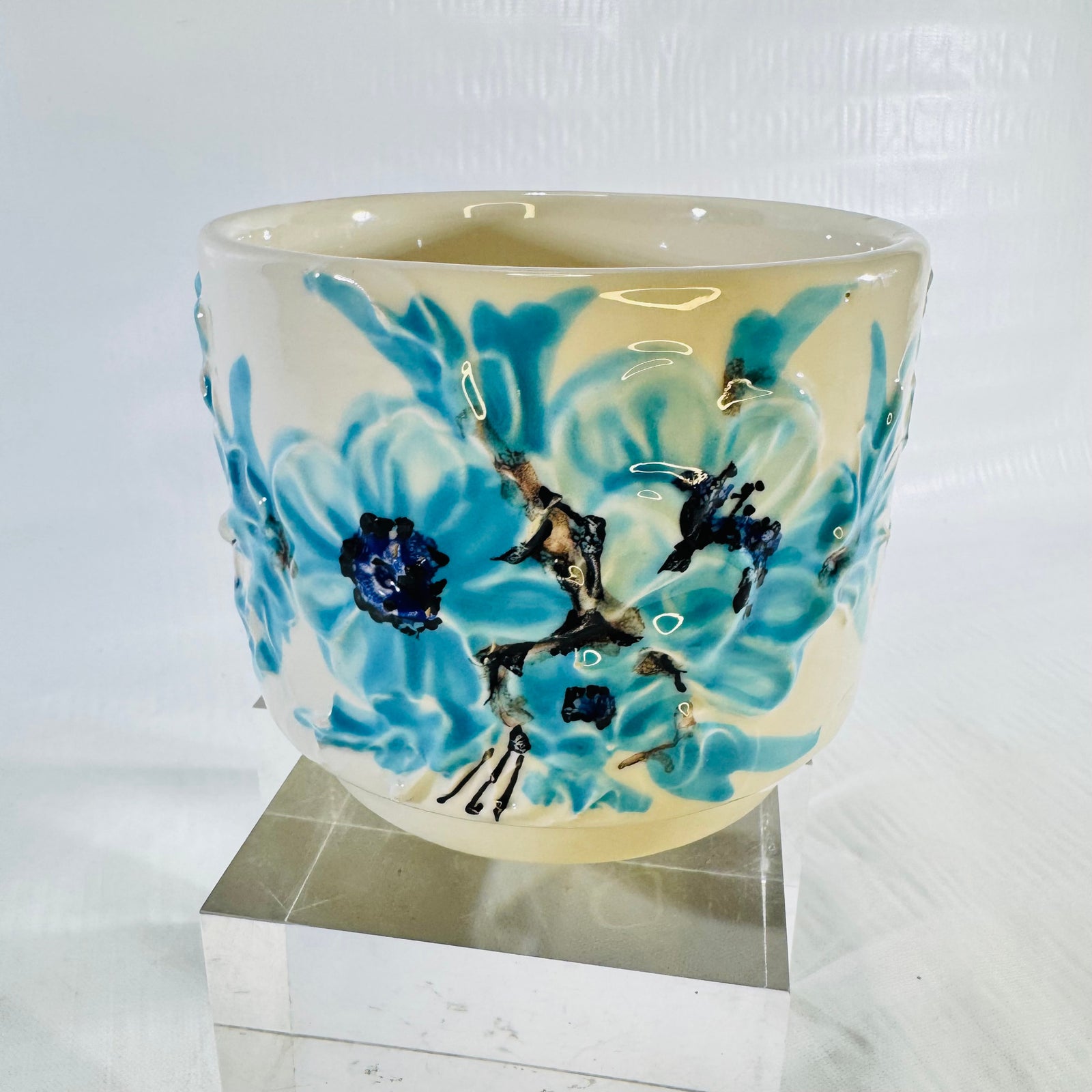 1970s Italian ivory ceramic planter with raised turquoise blue flowers front view