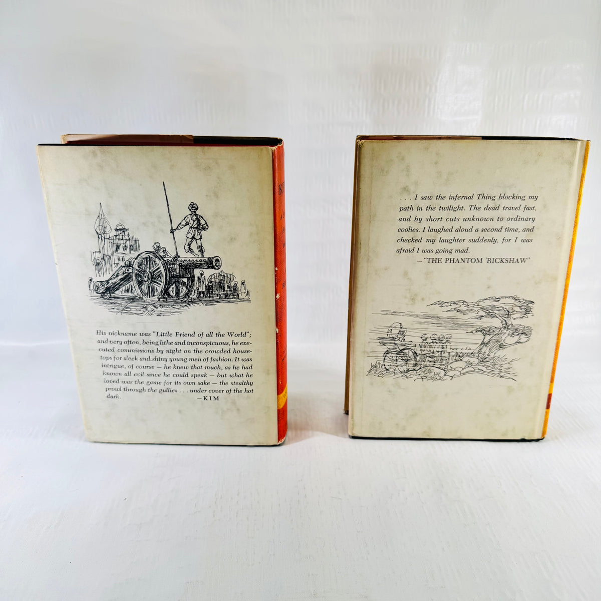 Back covers of both jackets, one showing a cannon and one The Phantom Rickshaw