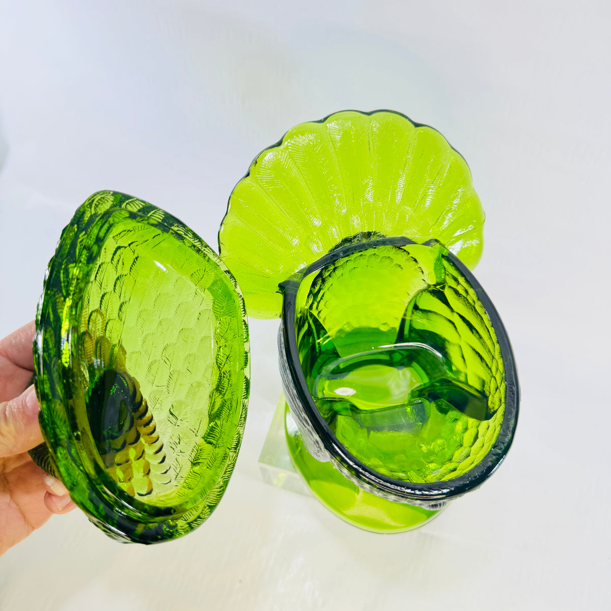 Green glass turkey lid lifted off the footed nest base