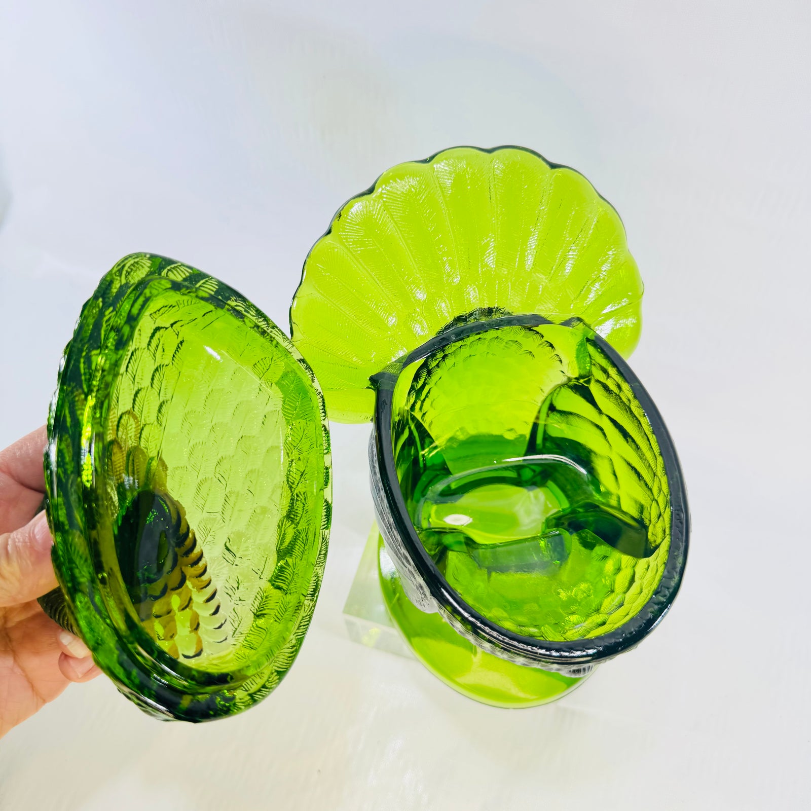 Green glass turkey lid lifted off the footed nest base