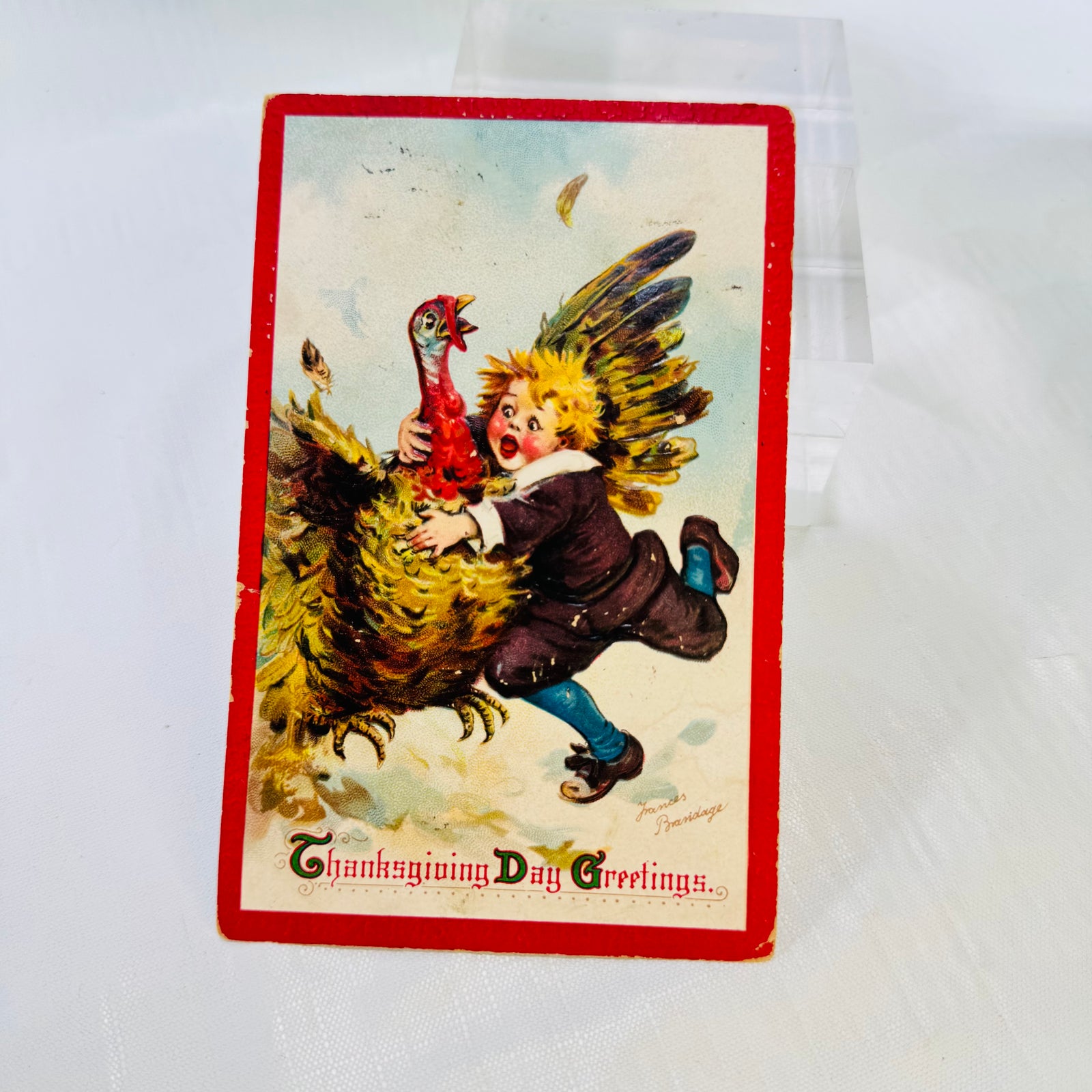 Antique Frances Brundage Thanksgiving Day Greetings postcard with boy and turkey