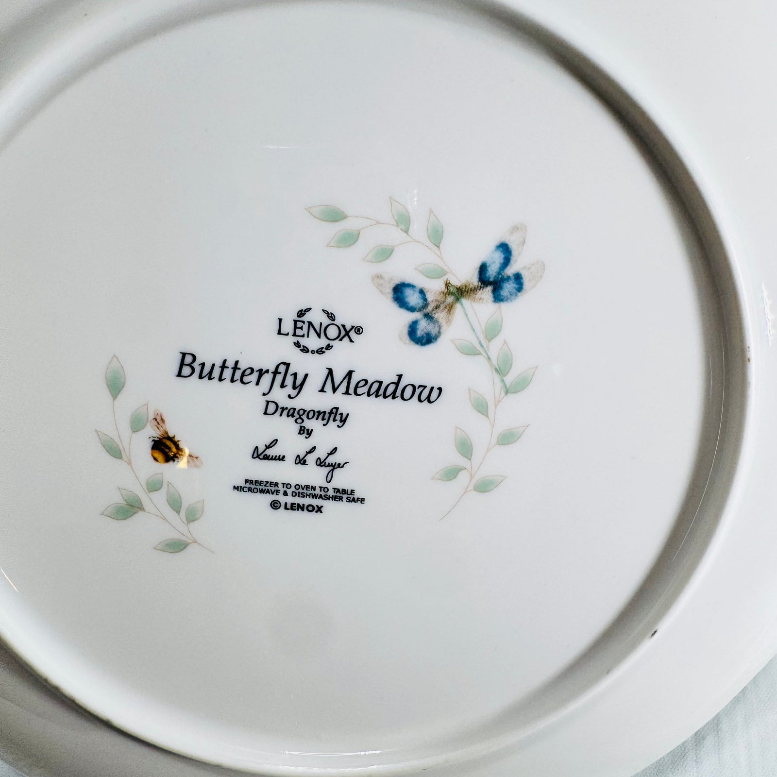 Close view of Lenox Butterfly Meadow Dragonfly backstamp with dragonfly art and Louise Le Luyer signature