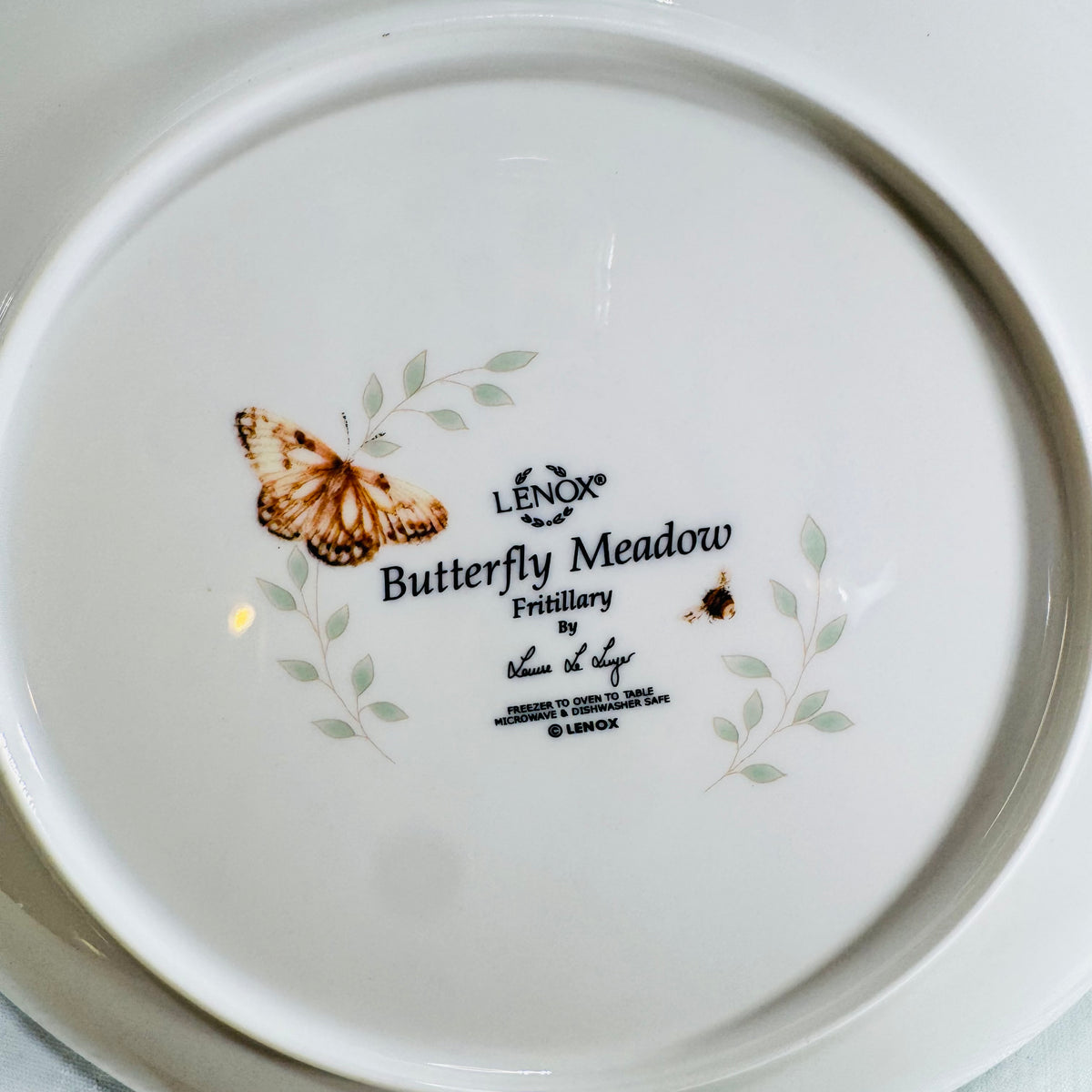 Close view of Lenox Butterfly Meadow Fritillary backstamp with Fritillary butterfly art and designer signature