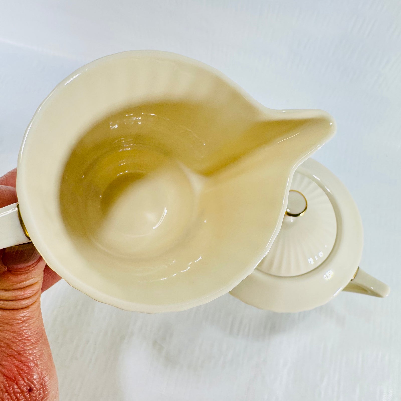 Top view into the Lenox Rutledge creamer with sugar bowl and fluted lid beside it