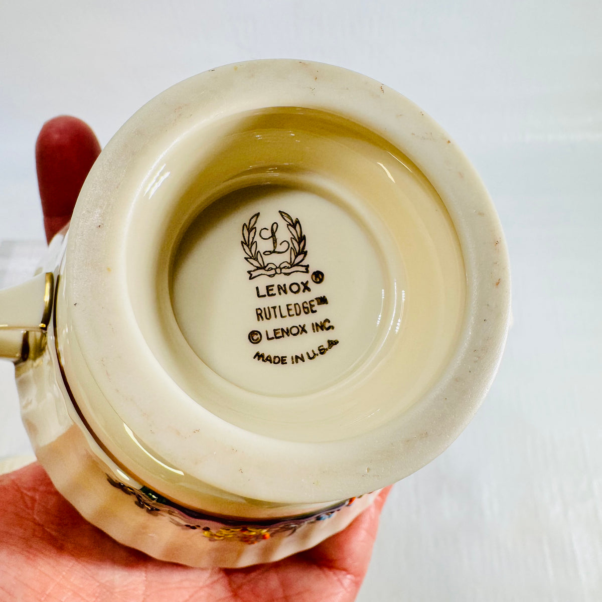 Close view of the Lenox Rutledge wreath mark reading Made in USA on the creamer base
