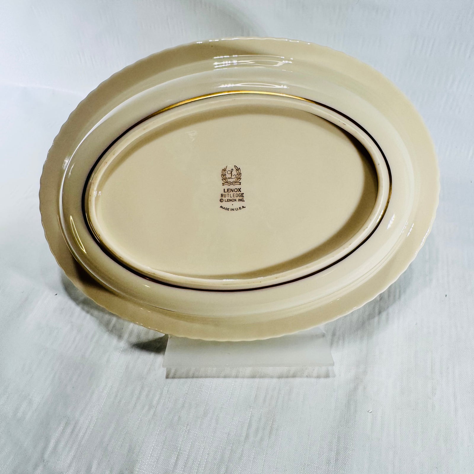 Underside of the Lenox Rutledge oval bowl showing the footed base with gold line