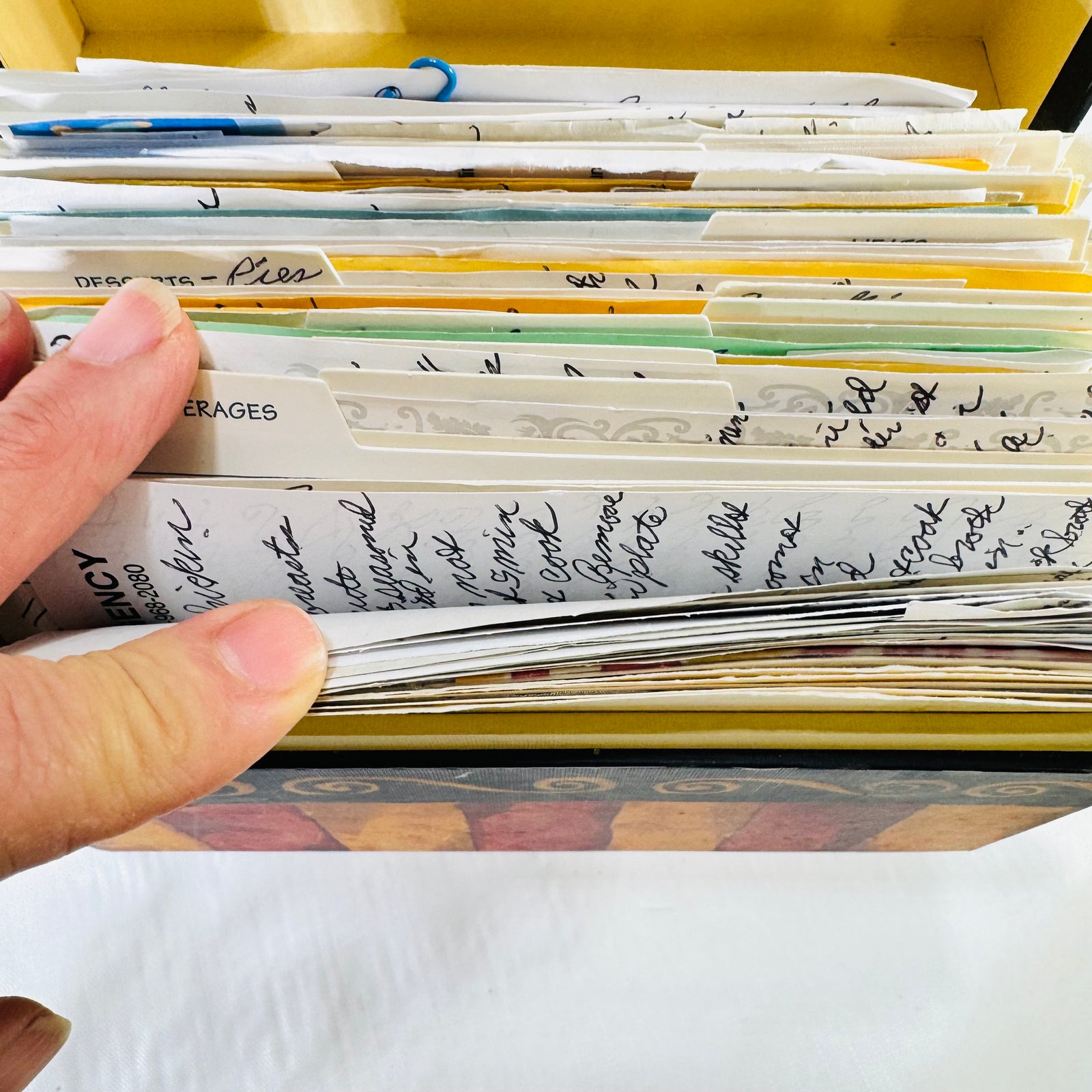 Main Street Press Romance recipe box open and packed full of handwritten recipe cards