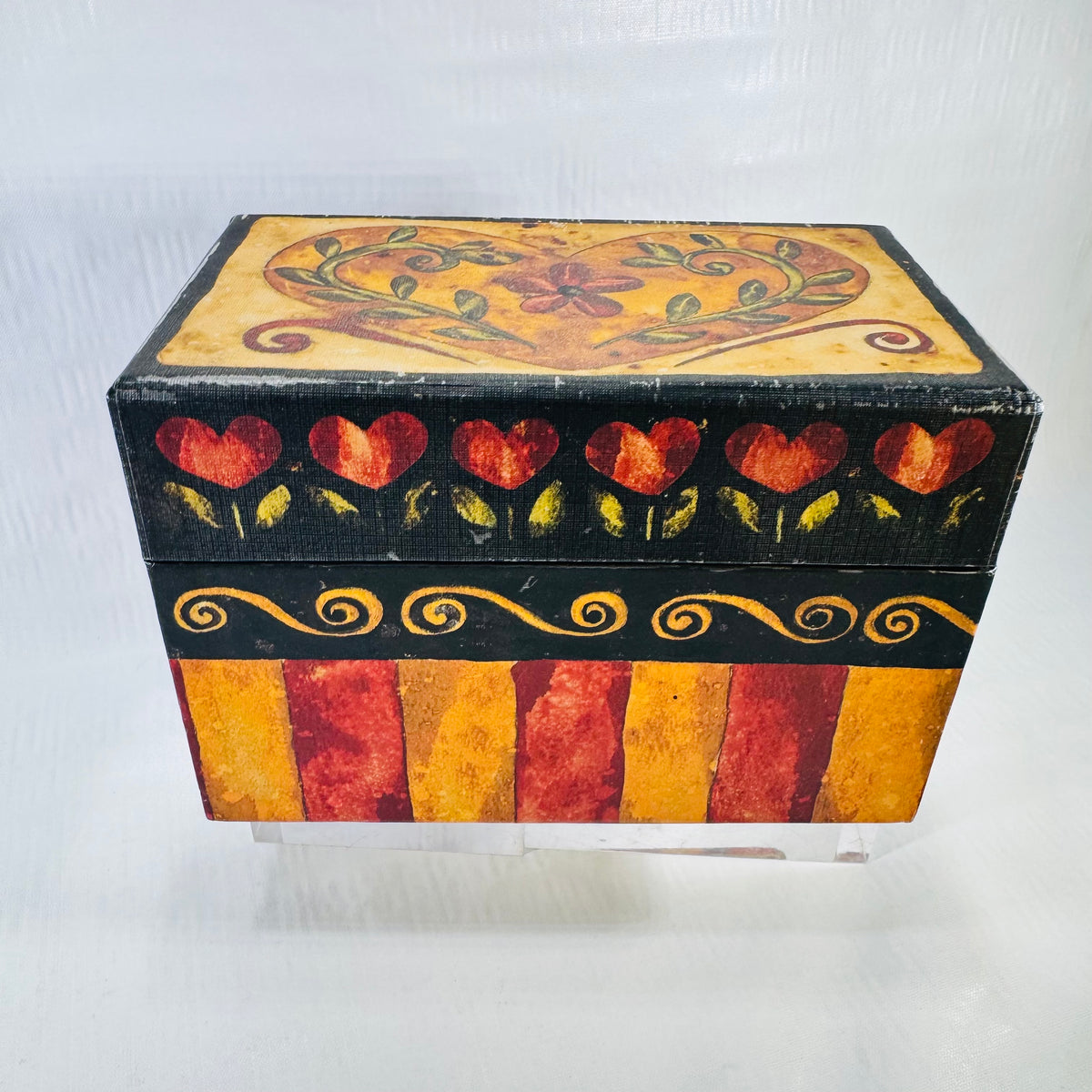 Front of the Karen Hillard Crouch Romance recipe box with red hearts, gold swirls, and stripes