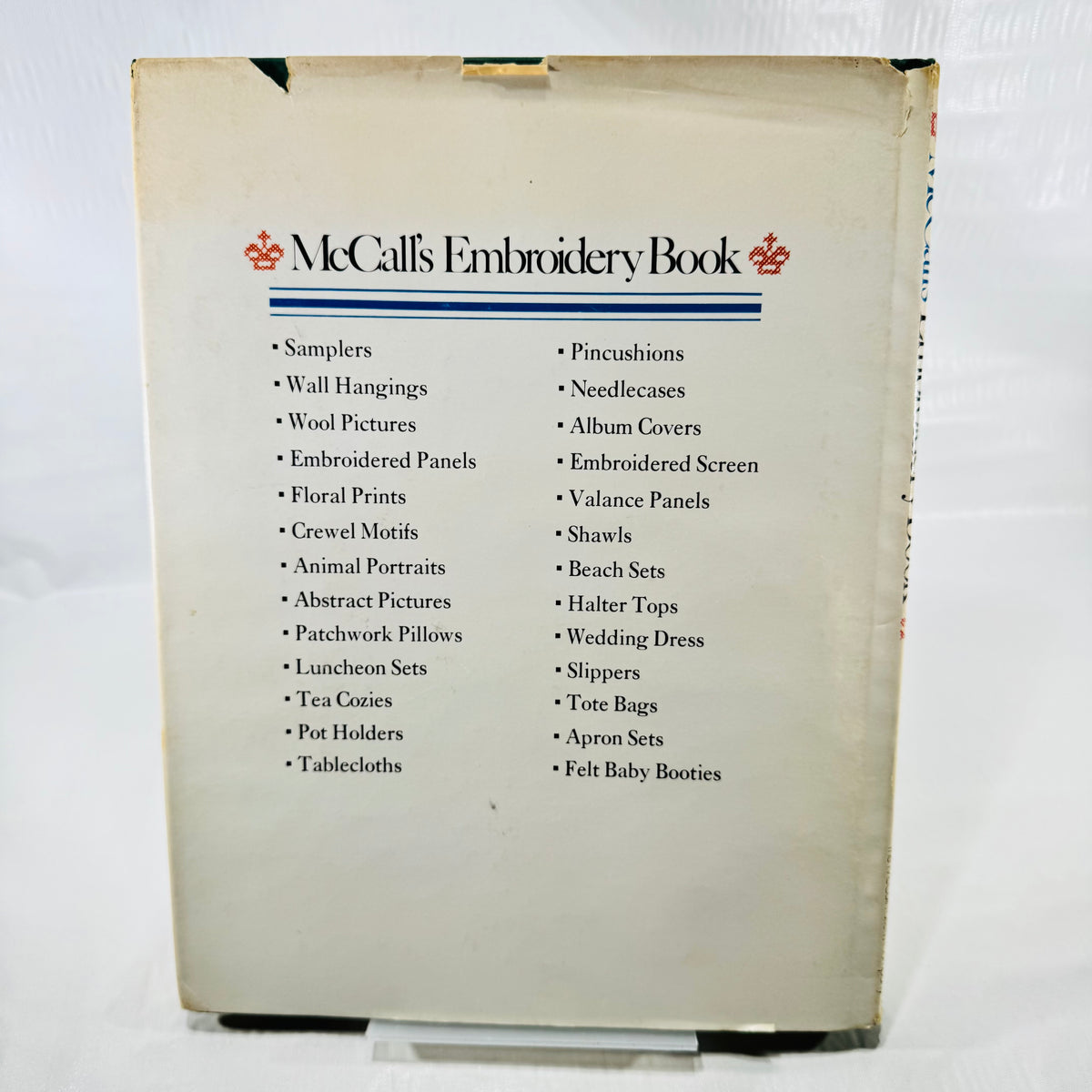 McCall's Embroidery Book back dust jacket listing samplers, tablecloths and more projects