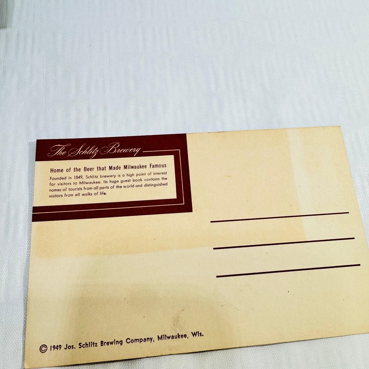 Schlitz postcard back with 1949 copyright and visible age toning