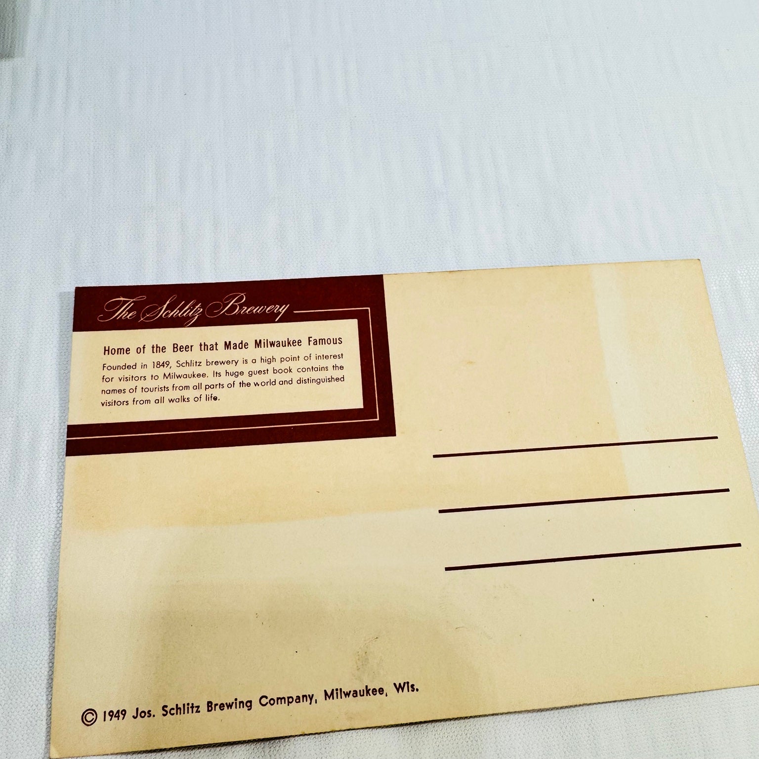 Schlitz postcard back with 1949 copyright and visible age toning