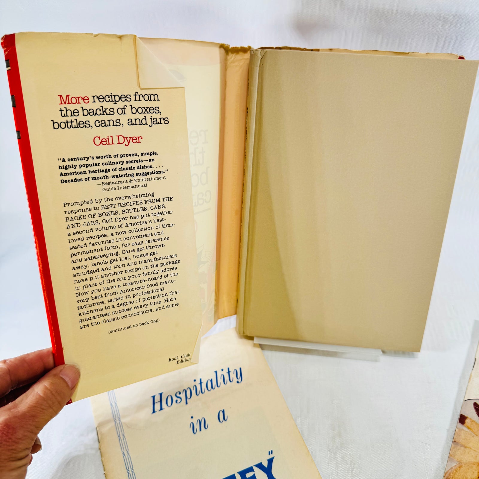 Three vintage cookbooks arranged in a triangle, Ceil Dyer, Jiffy and Pillsbury