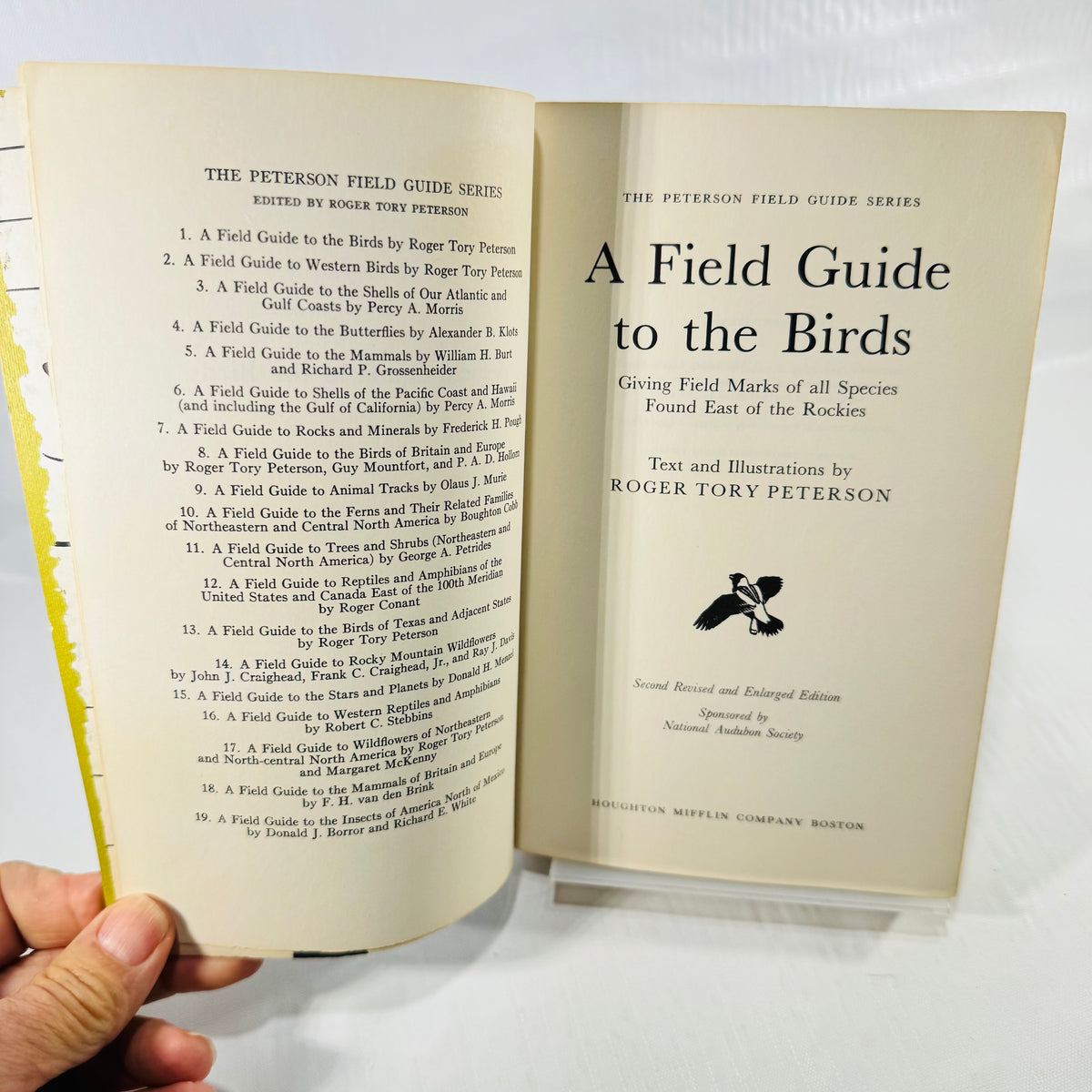 Title page of A Field Guide to the Birds by Roger Tory Peterson, Second Revised and Enlarged Edition, beside the Peterson Field Guide Series list.