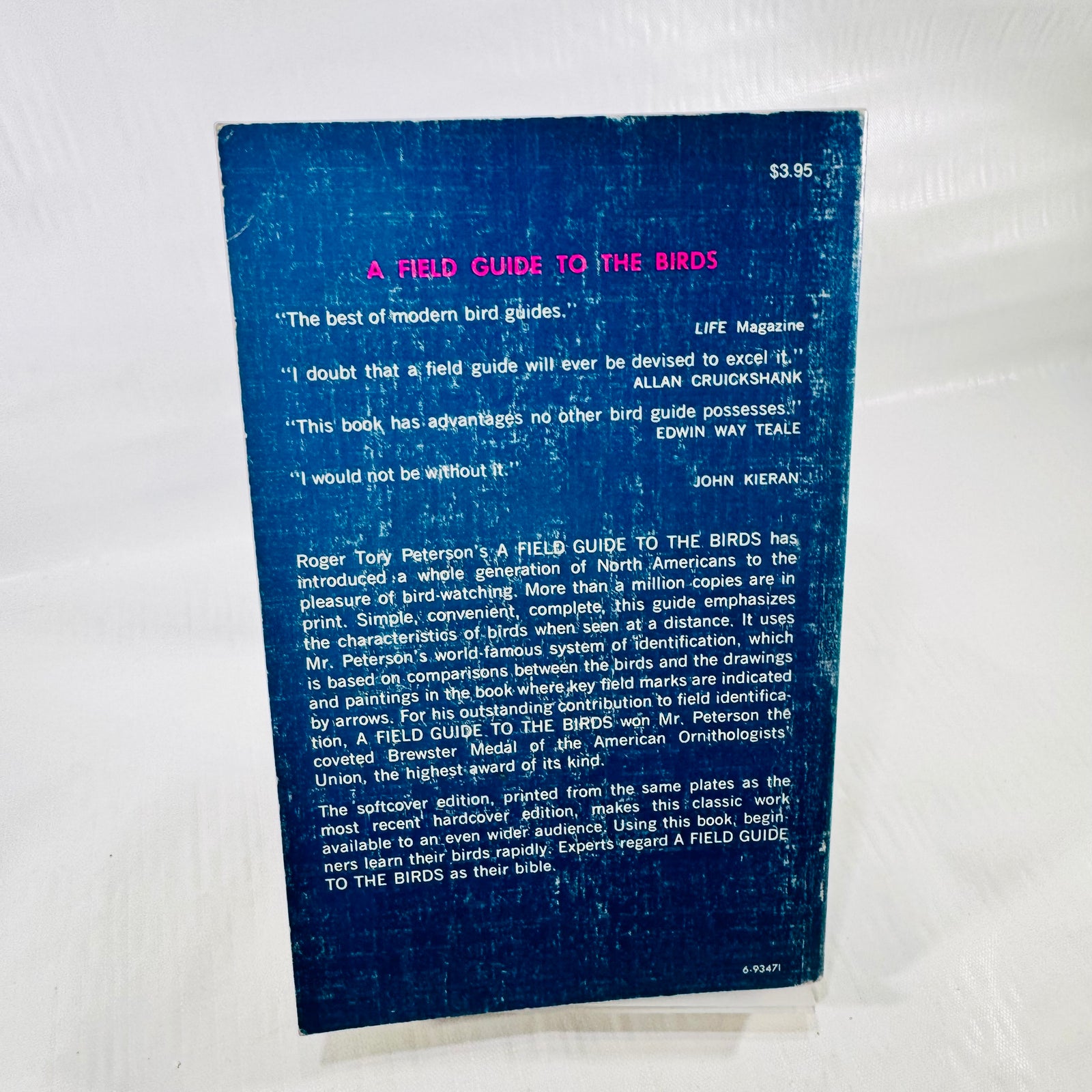 Blue back cover of Peterson's A Field Guide to the Birds, showing review excerpts, book information, the $3.95 printed price, and extensive rubbing.