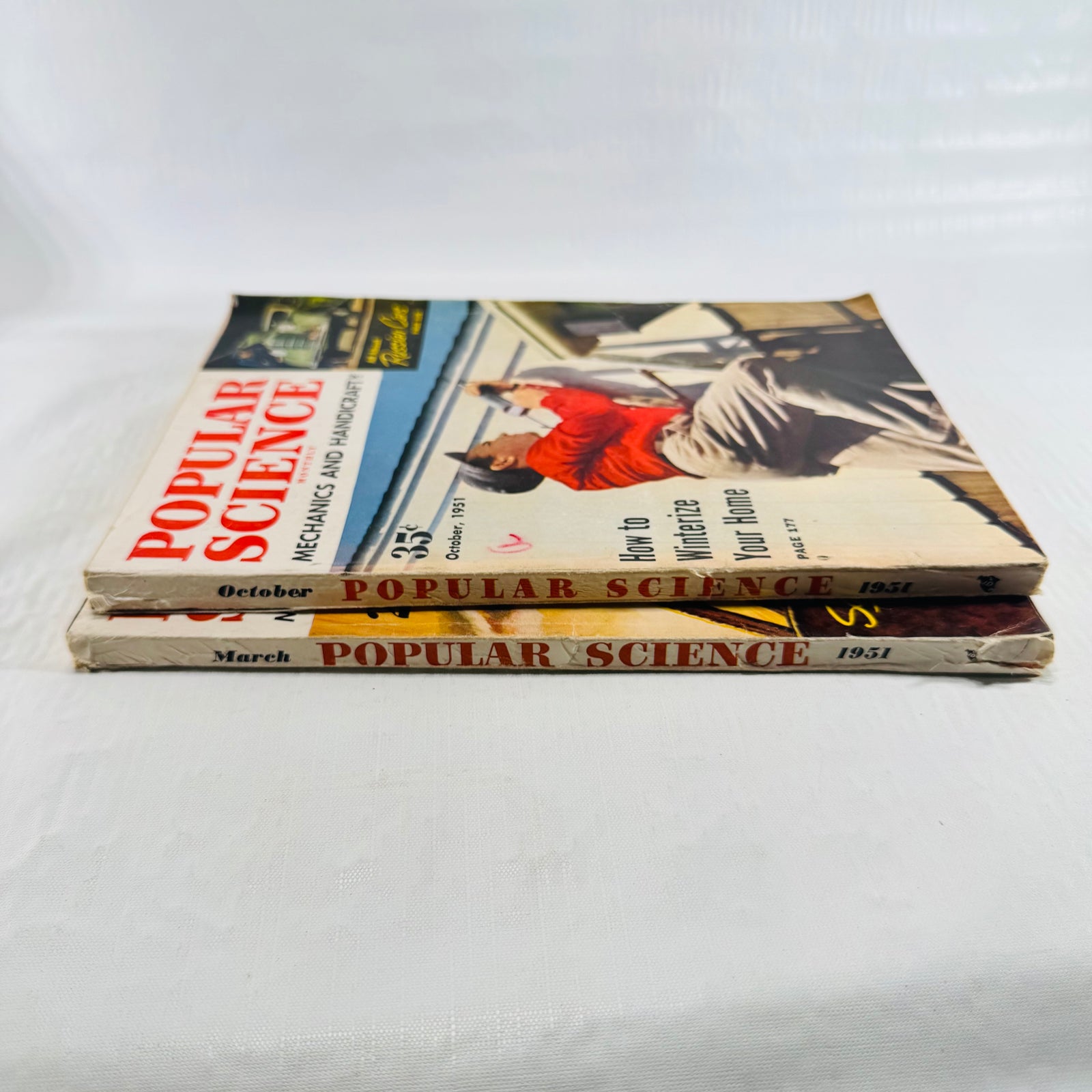Spines of both magazines side by side, printed October 1951 and March 1951