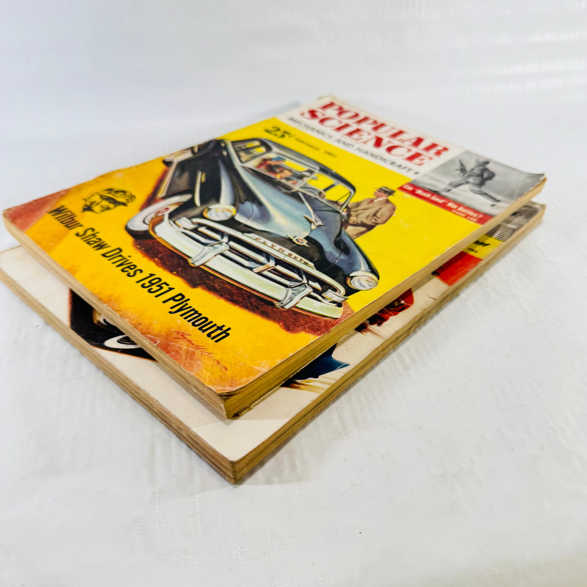 February 1951 Popular Science Plymouth cover stacked diagonally over the May Little Cars issue